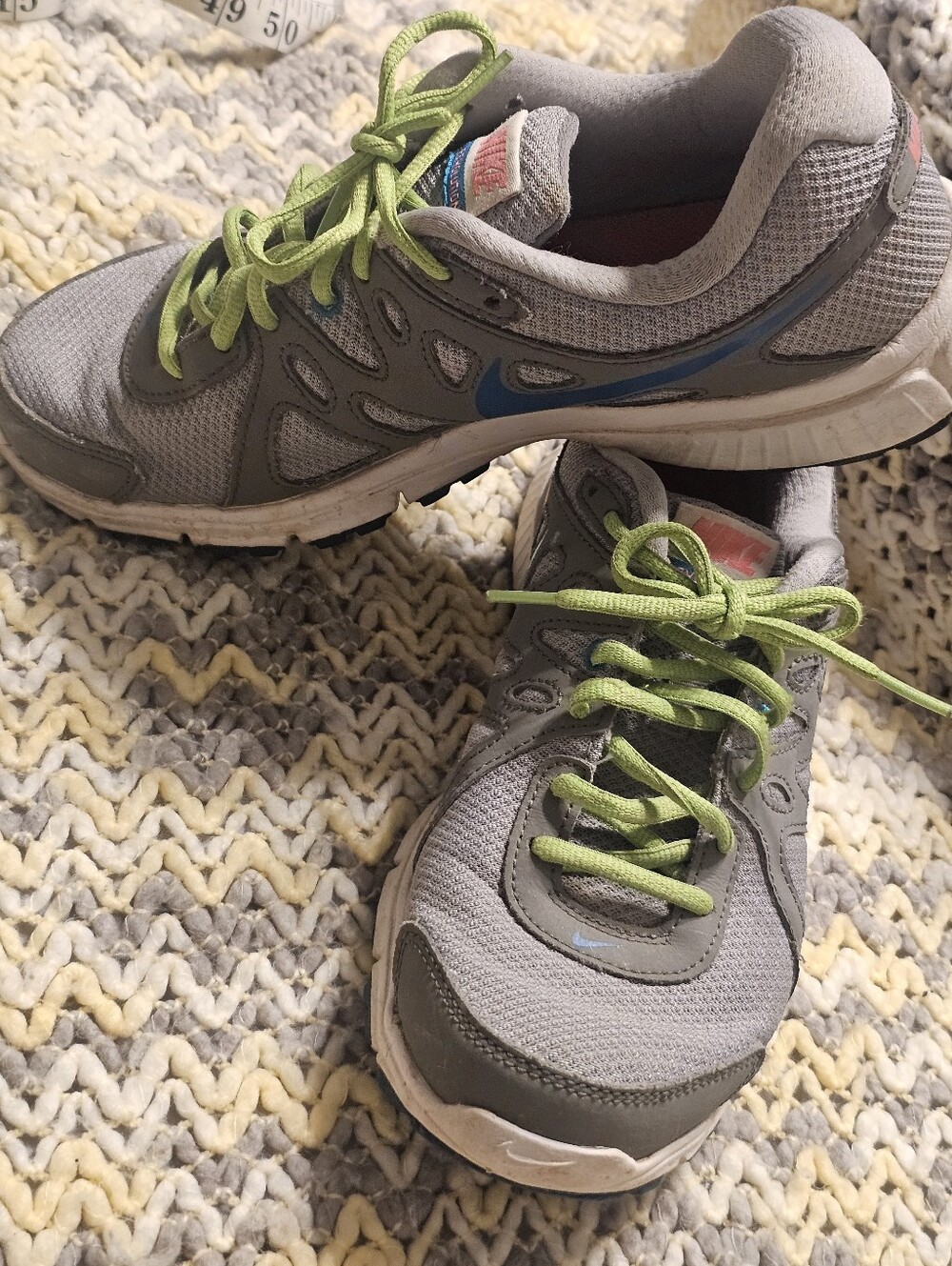 Nike Gray Mesh Sneaker with Lime Laces, Pink And Blue Accent And Logo.